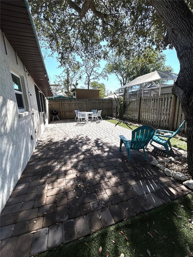 wooden deck with a patio