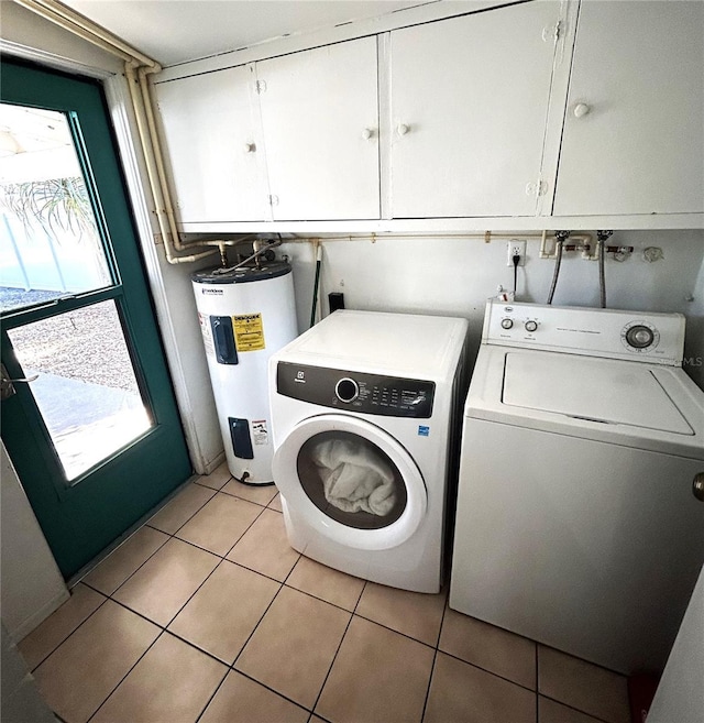 laundry room with separate washer and dryer, cabinets, a wealth of natural light, and water heater