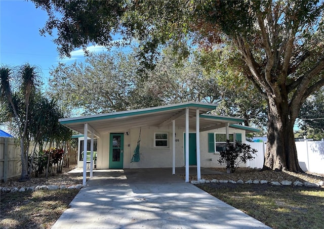 view of front of home with a carport