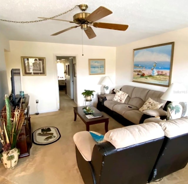 carpeted living room featuring ceiling fan