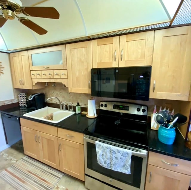 kitchen with sink, light brown cabinets, and black appliances