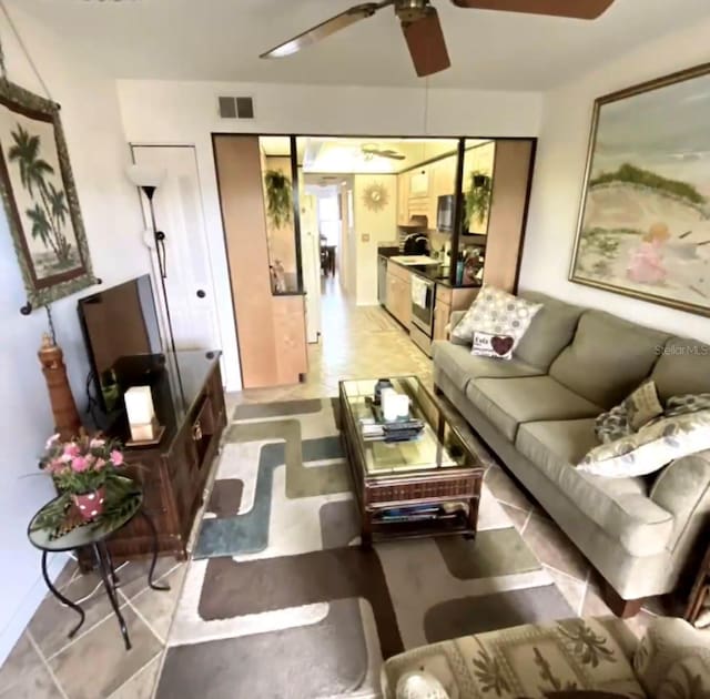 living room featuring ceiling fan