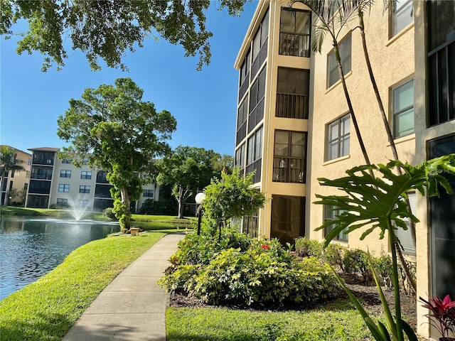 surrounding community featuring a water view