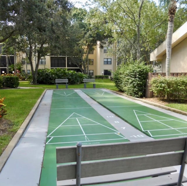 view of home's community featuring a lawn