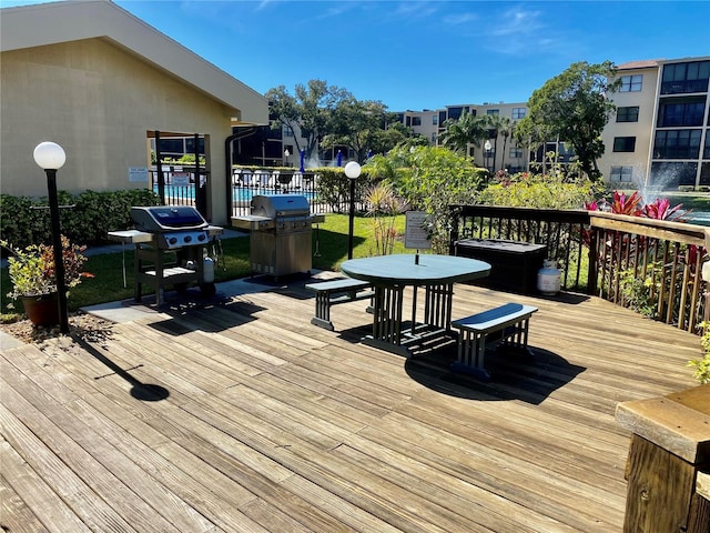 wooden terrace featuring grilling area