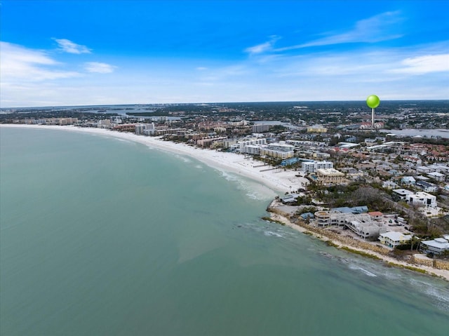 bird's eye view with a water view and a beach view