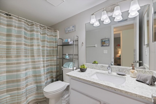 bathroom with a shower with curtain, vanity, and toilet