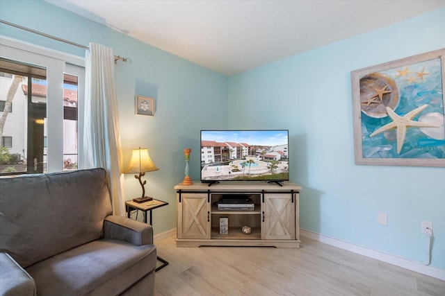 living area with light hardwood / wood-style floors