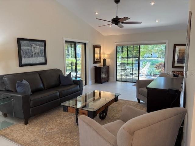 living room featuring plenty of natural light, high vaulted ceiling, and ceiling fan