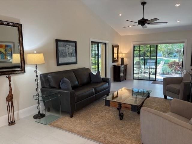 living room featuring ceiling fan and high vaulted ceiling