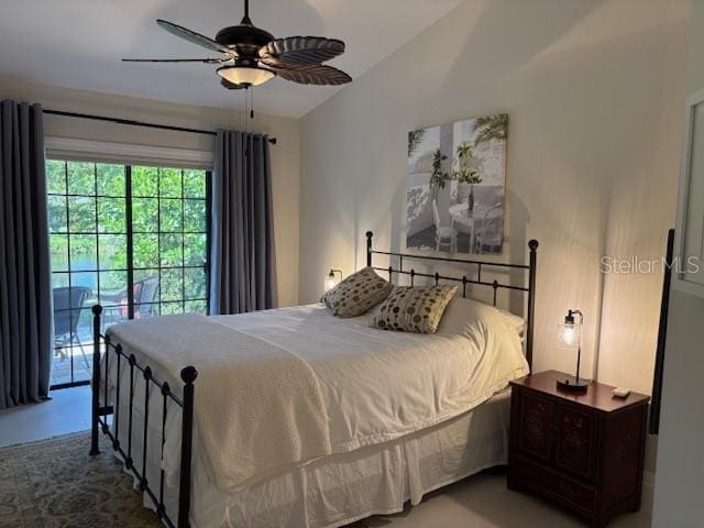 bedroom with vaulted ceiling, ceiling fan, and access to outside