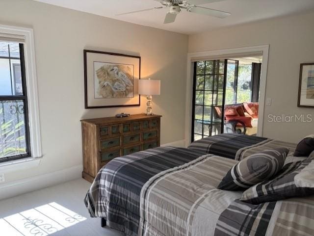 bedroom featuring carpet floors, access to outside, and ceiling fan