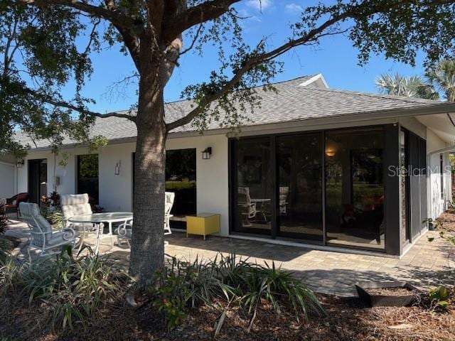 rear view of house featuring a patio