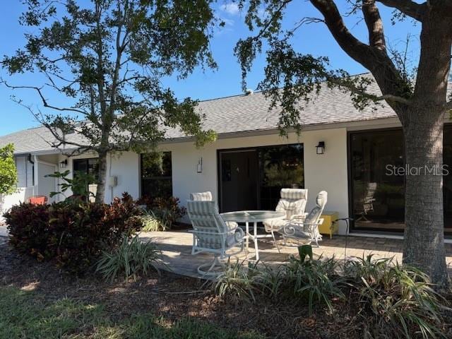 back of house with a patio area