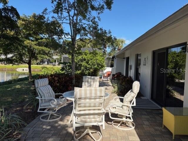 view of patio / terrace featuring a water view