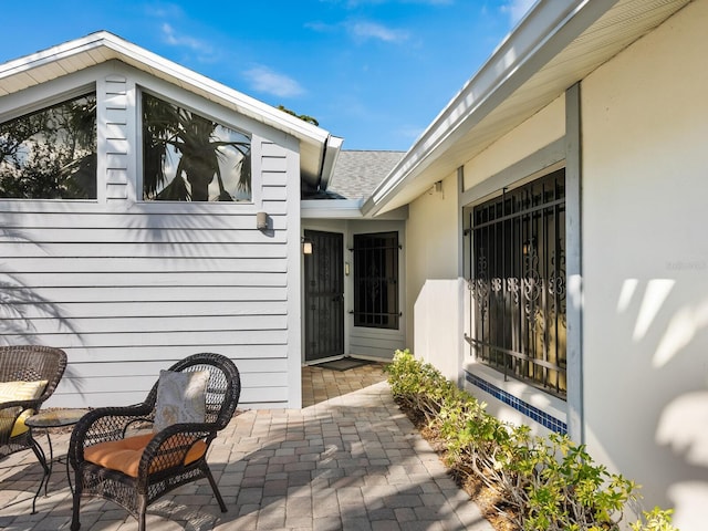 property entrance with a patio area