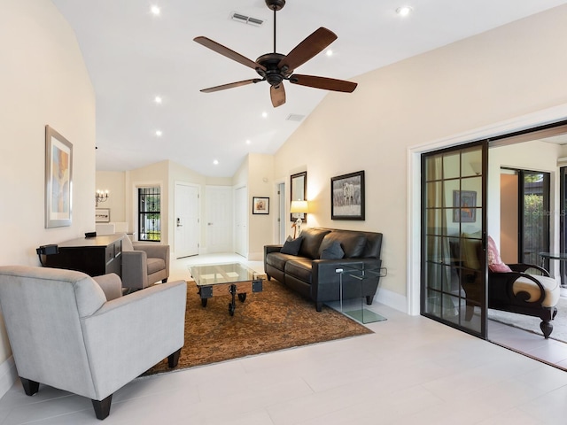 living room featuring ceiling fan with notable chandelier and high vaulted ceiling