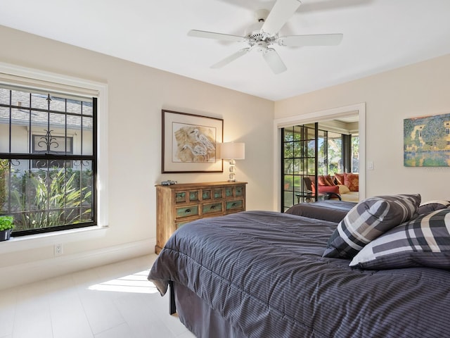 bedroom featuring ceiling fan and access to outside