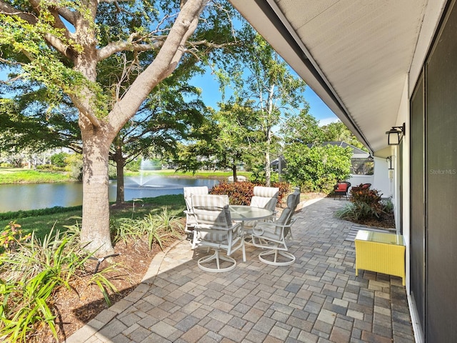 view of patio with a water view