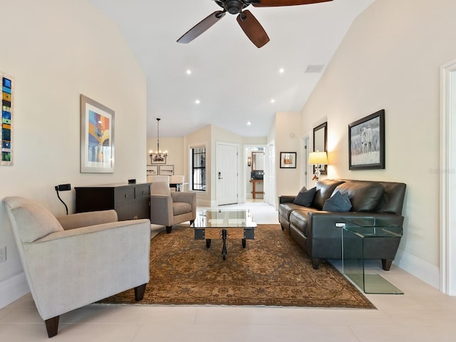 living room featuring ceiling fan with notable chandelier and high vaulted ceiling