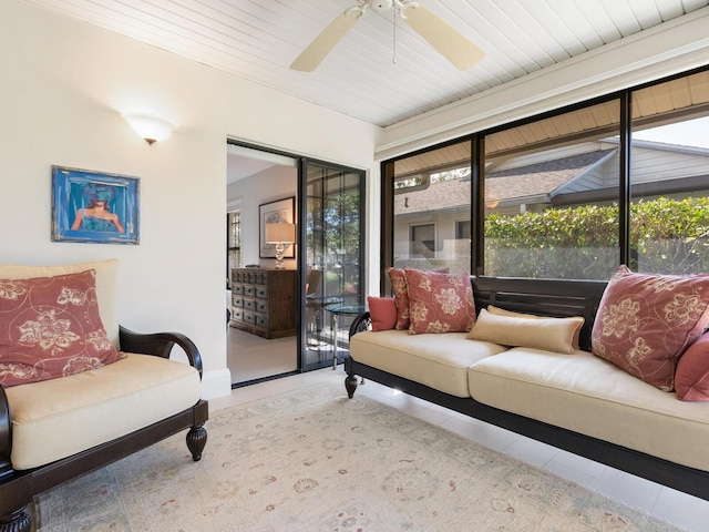 living room with light tile patterned flooring and ceiling fan