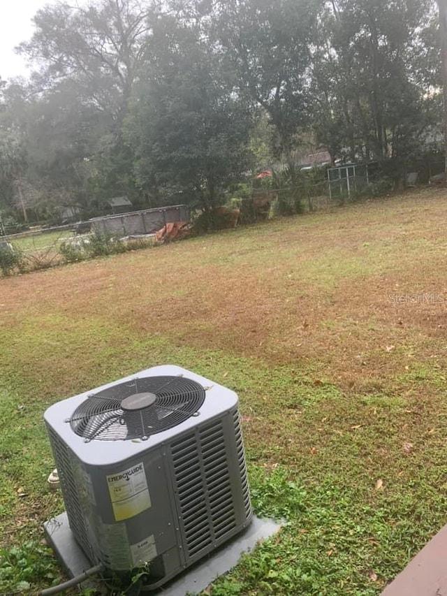 view of yard with central air condition unit