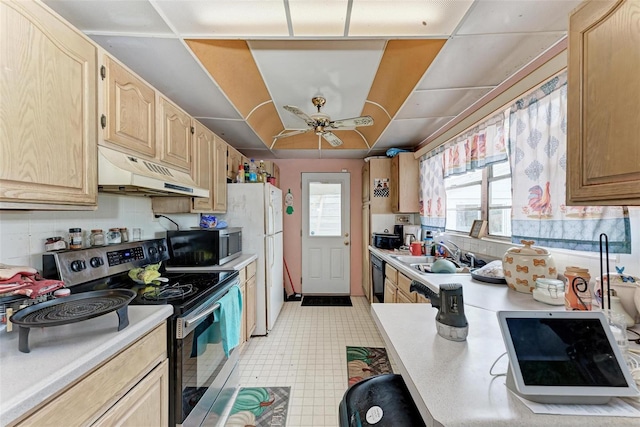 kitchen featuring stainless steel appliances, sink, light brown cabinetry, and ceiling fan