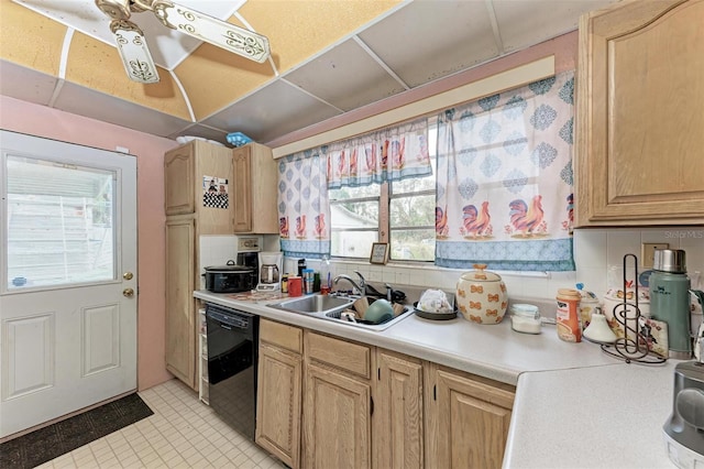 kitchen featuring sink, light brown cabinets, plenty of natural light, black dishwasher, and decorative backsplash