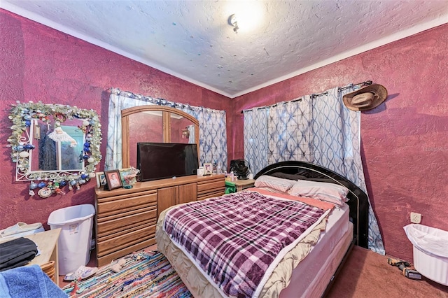 bedroom with a textured ceiling and carpet