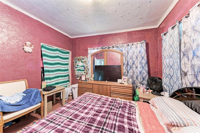 bedroom with ornamental molding and a textured ceiling