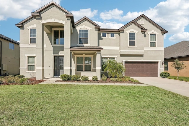 view of front facade featuring a garage and a front lawn