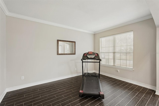 workout room featuring crown molding