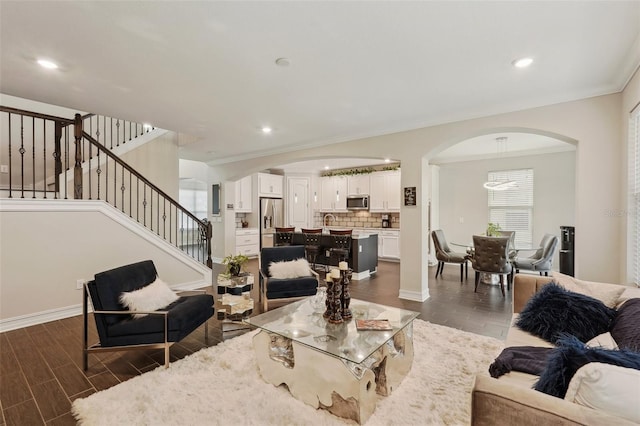 living room with ornamental molding