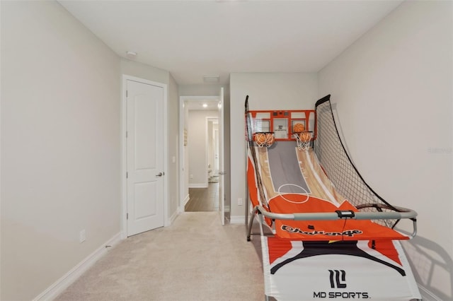 game room with light carpet