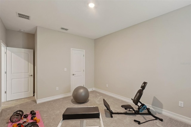 exercise room with light carpet