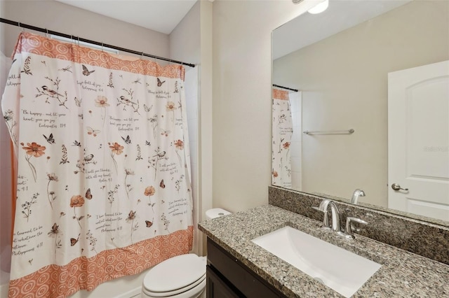 full bathroom featuring vanity, shower / bath combination with curtain, and toilet