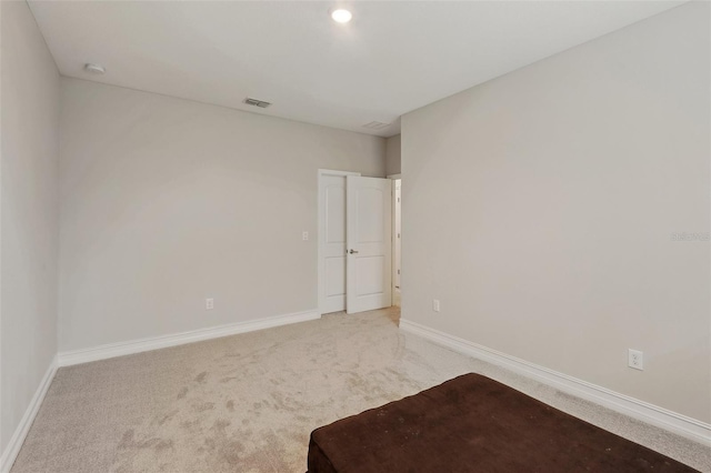 unfurnished room with carpet flooring