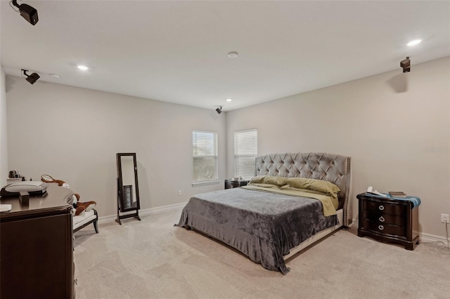 bedroom featuring light carpet