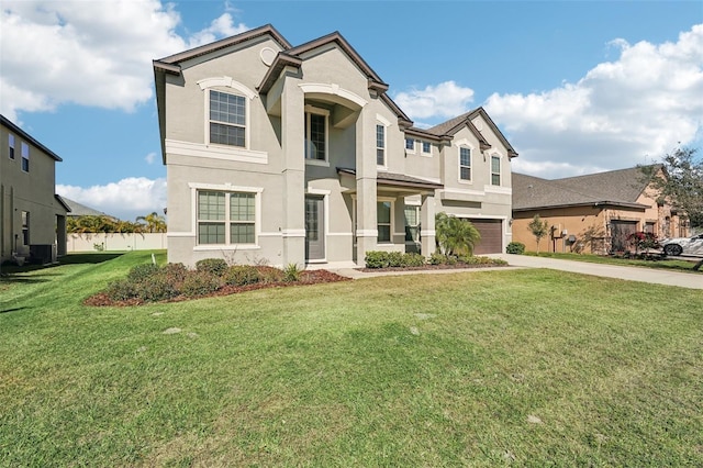 view of front facade with a garage and a front lawn