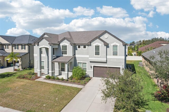 view of front of home with a garage and a front yard