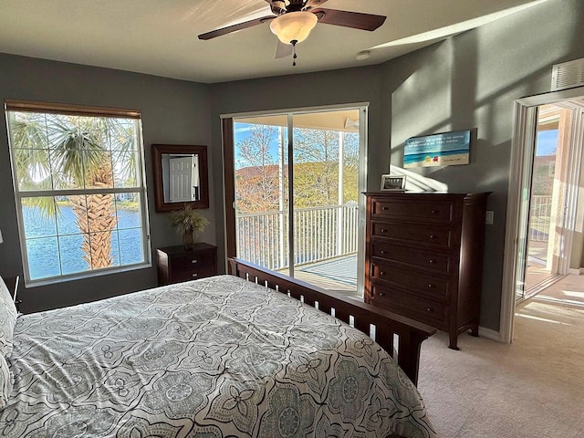 bedroom featuring ceiling fan, access to exterior, and light colored carpet