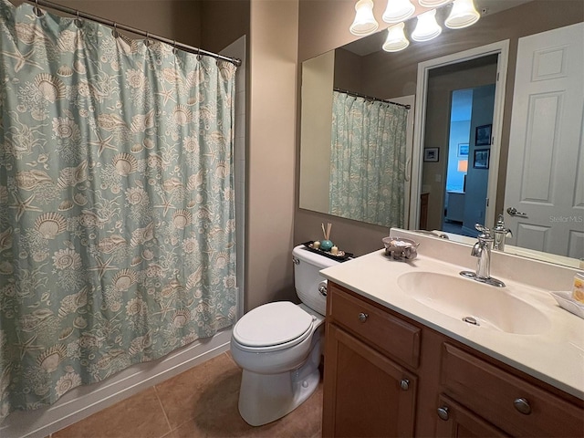 bathroom with tile patterned flooring, a shower with curtain, vanity, and toilet