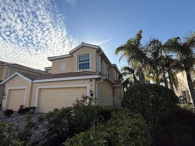 view of property exterior featuring a garage