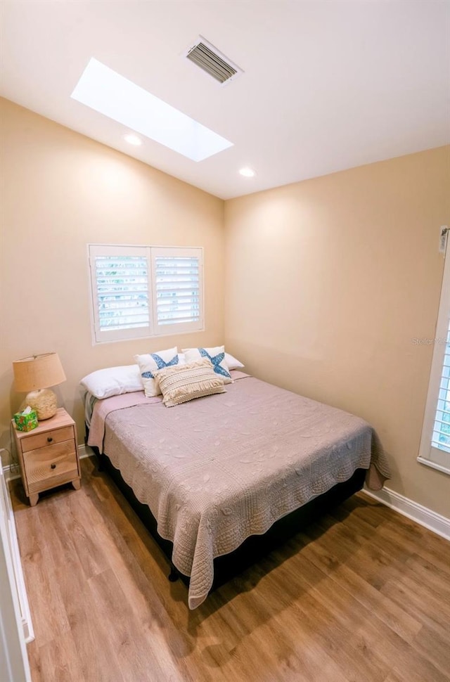 bedroom with light hardwood / wood-style flooring