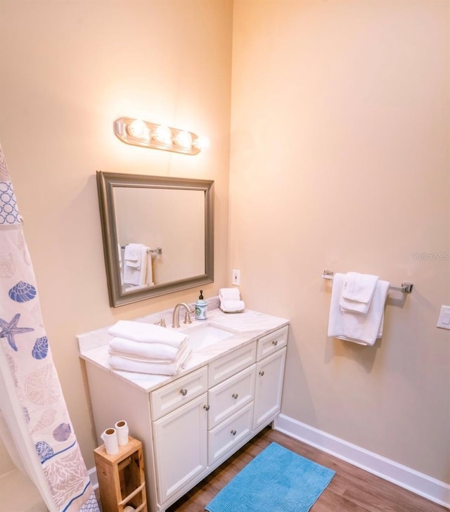 bathroom featuring wood-type flooring and vanity