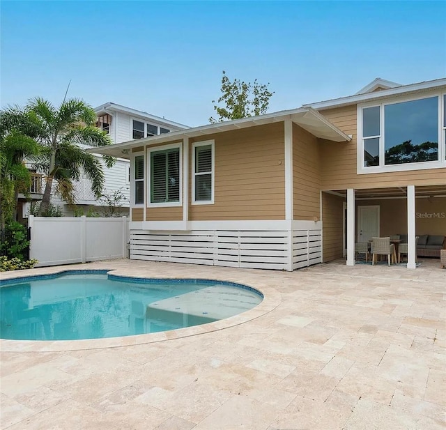 view of swimming pool with a patio