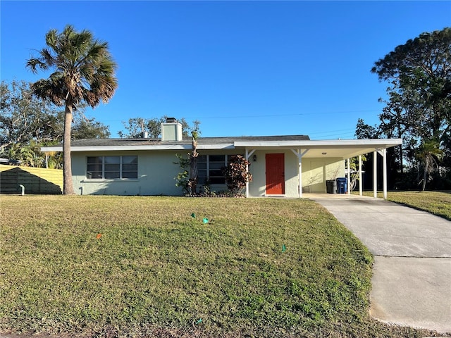 ranch-style home featuring a carport and a front yard