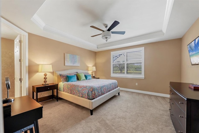 carpeted bedroom with ornamental molding, a raised ceiling, and ceiling fan