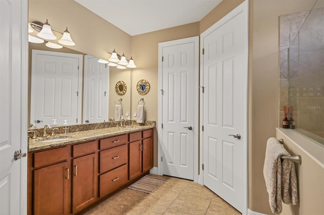 bathroom with vanity and tile patterned flooring