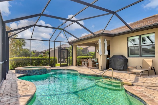 view of pool with an in ground hot tub, grilling area, a lanai, and a patio area